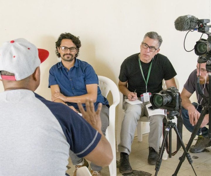 Desert Sun reporter Gusatvo Solis (background, from left), Arizona Republic reporter Daniel González and Republic videographer David Wallace interview a human smuggler in Mexicali, Mexico. Photo by Nick Oza/USA TODAY NETWORK