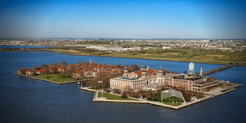 Decoration only: An aerial photo of Ellis Island on a clear, sunny day.